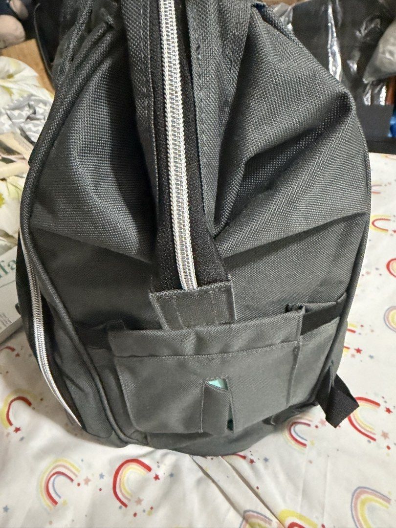 Motif Diaper Bag with 4 Bottles (Category: Diaper Bags & Wetbags) located in Makati City. Submitted by marowebg (Listing ID 1428540740, Image 2). Description: Motif diaper bag is perfect for parents on the go. It features multiple compartments, including insulated pockets and a spacious interior. The bag comes with several Motif baby bottles. It has a stylish design with a front pocket and comfortable backpack straps..