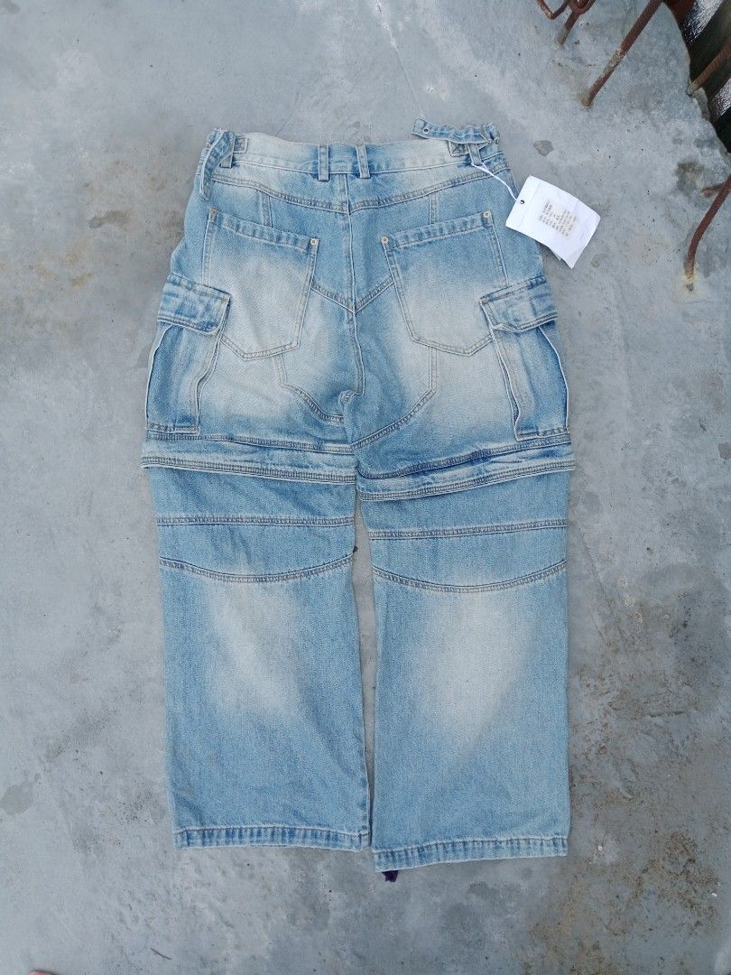 MUYI Detachable Jeans - Size 36 (Category: Jeans) located in Tanza. Submitted by llcoolj. (Listing ID 1428446205, Image 3). Description: Stylish detachable jeans from MUYI. Features a light blue wash and cargo pockets. The jeans can be converted into shorts. Size 36. Includes original tags. Made in Guangzhou, China. The jeans have a unique design with a zip-off feature, allowing for versatile wear. Perfect for a casual and trendy look..