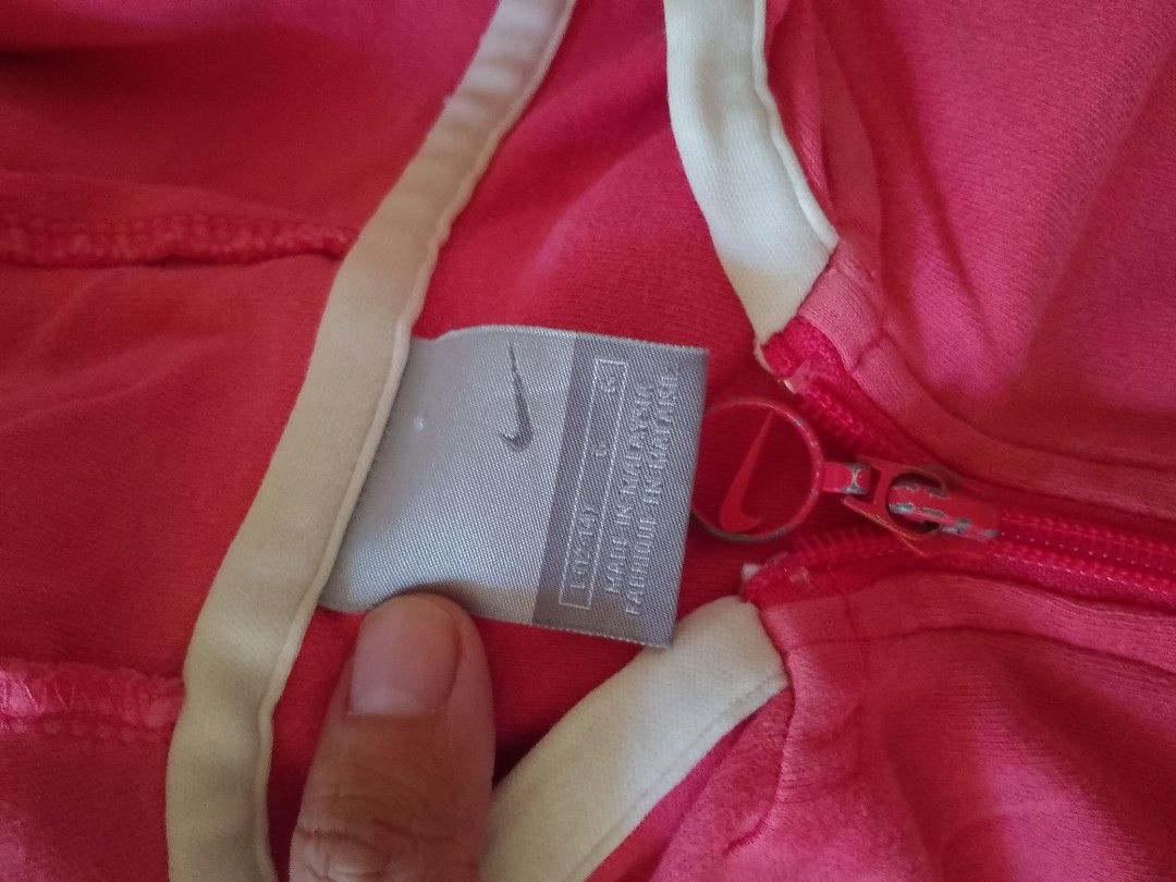 Nike Pink Zip-Up Hoodie (Category: Coats, Jackets and Outerwear) located in Quezon City. Submitted by mommagecko (Listing ID 1428502842, Image 2). Description: Nike Pink fits M to L ships thru J&T 📍Quezon City.