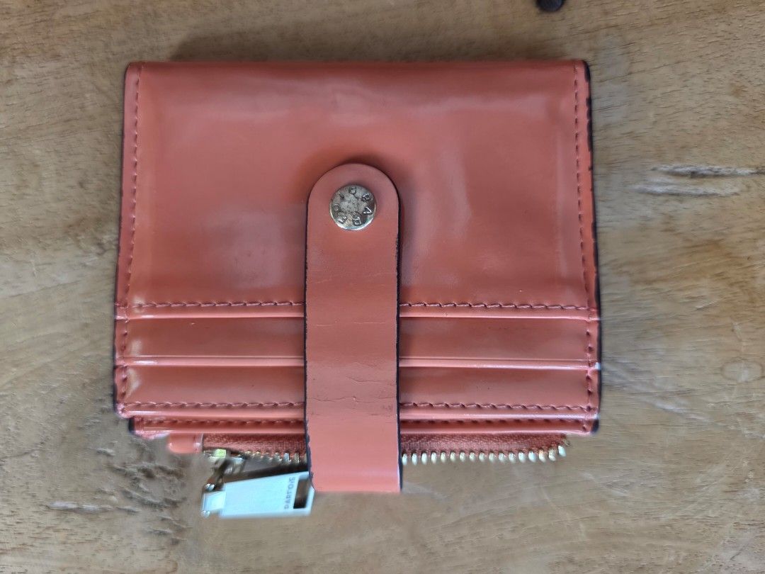 Peach-colored Card Wallet with Zipper (Category: Wallets & Card holders) located in Cebu City. Submitted by mtdsala (Listing ID 1428578154, Image 1). Description: Decluttering. Fairly used with signs of usage..