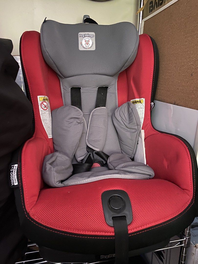 Peg Perego Viaggio 0+1 Switchable Car Seat (Category: Car Seats) located in Makati City. Submitted by rye16 (Listing ID 1428605933, Image 1). Description: Peg Perego Viaggio 0+1 Switchable car seat is red and gray. It features a five-point harness system and side impact protection. The seat has a comfortable design with padded headrest and side supports. The seat is suitable for infants and toddlers..