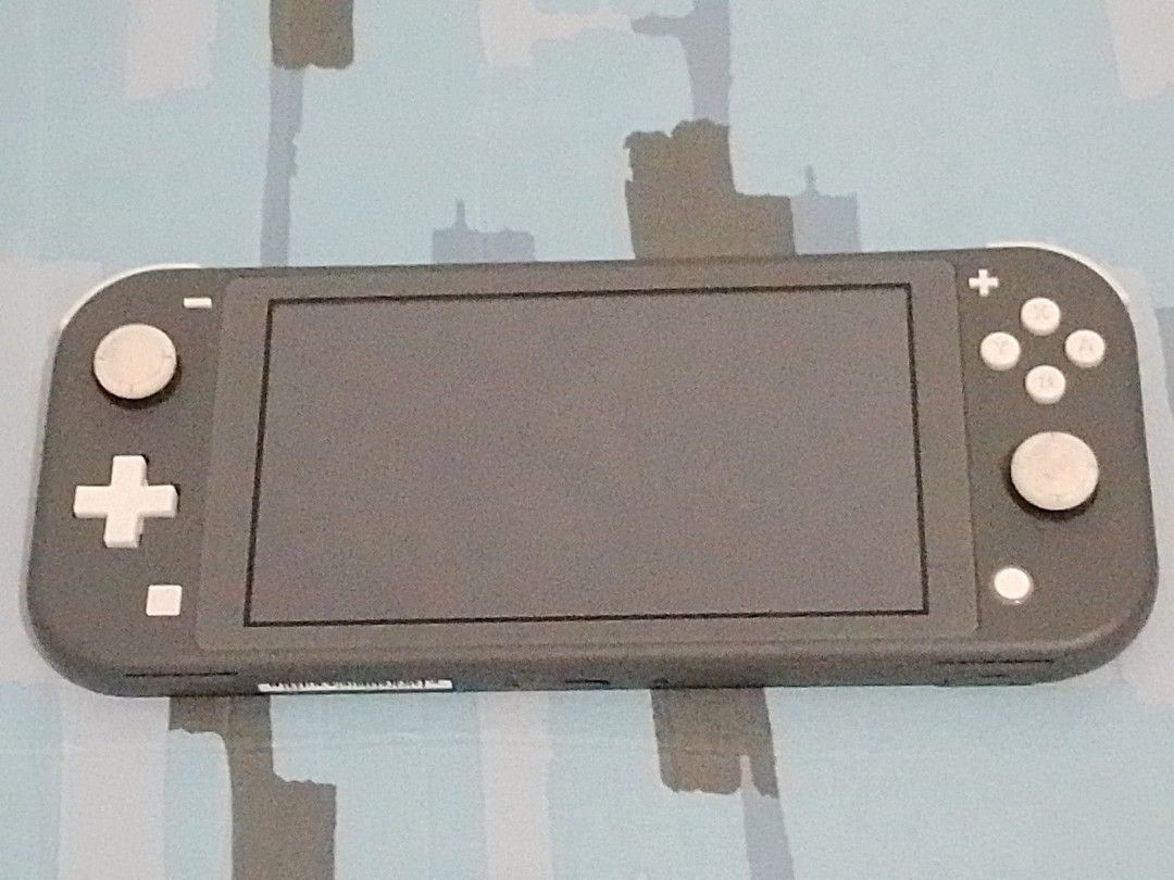 (PLEASE READ!) Nintendo Switch Lite Grey (FOR PARTS?) (AS-IS) (Category: Nintendo) located in Mainit. Submitted by davidkritz76401 (Listing ID 1428557501, Image 1). Description: (UNAVAILABLE UNTIL FUTHER NOTICE. UNFORTUNATELY, SINCE I MOVED OUT FROM THE PROVINCE I WASN'T ABLE TO BRING THIS WITH ME DUE TO WEIGHT AND LOGISTICS PROBLEMS. I DEEPLY APOLOGIZE.) Switch Lite in Grey. It still turns on and the controls are almost fully working except for 