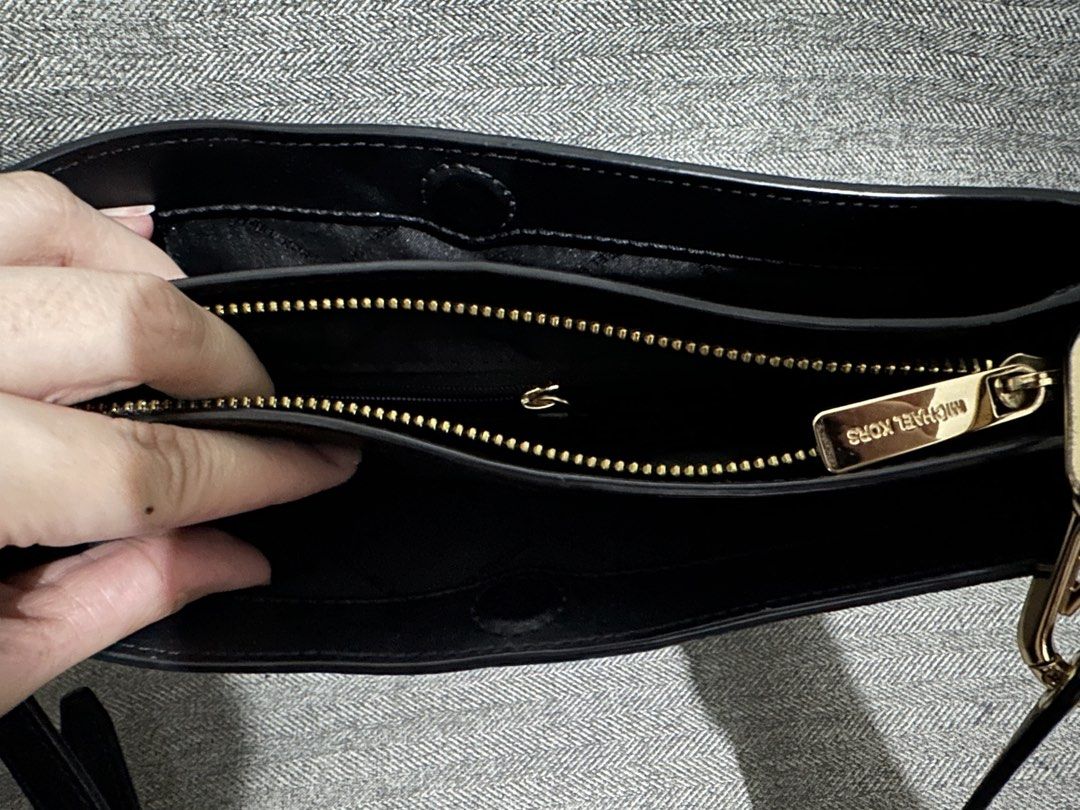 Pre-loved Authentic Michael Kors Black Crossbody Bag (Category: Cross-body Bags) located in Manila. Submitted by mjtmi (Listing ID 1428576994, Image 3). Description: *Pebbled leather *3 compartments (magnetic closures, 1 zip closure in the middle) *1 slip pocket & 1 zip pocket inside the middle zip compartment *All gold hardware are in good condition, no faded part (logo, zipper, chain, sling handle lock) *Good condition leather sling/handle *A b