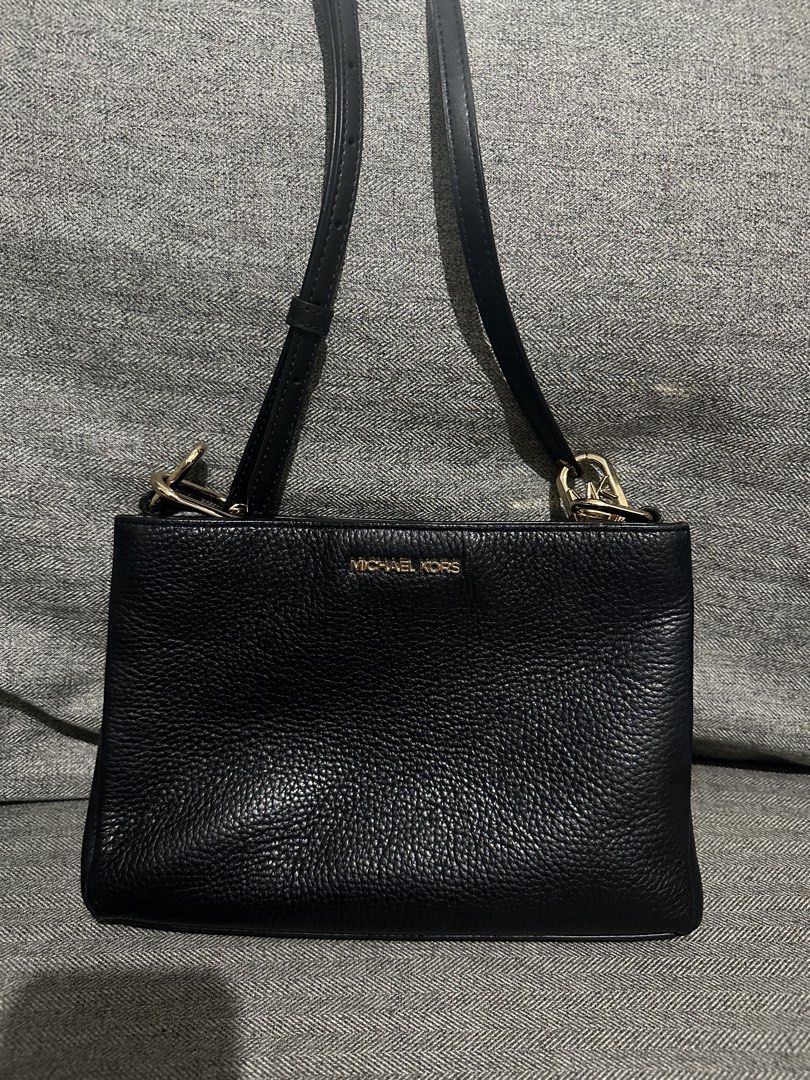 Pre-loved Authentic Michael Kors Black Crossbody Bag (Category: Cross-body Bags) located in Manila. Submitted by mjtmi (Listing ID 1428576994, Image 1). Description: *Pebbled leather *3 compartments (magnetic closures, 1 zip closure in the middle) *1 slip pocket & 1 zip pocket inside the middle zip compartment *All gold hardware are in good condition, no faded part (logo, zipper, chain, sling handle lock) *Good condition leather sling/handle *A b