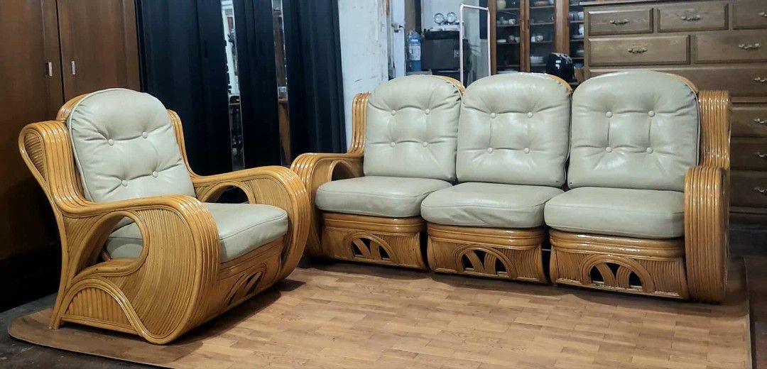 Rattan Sofa Set with Leather Cushions (Category: Sofas) located in Manila. Submitted by luckyfalcon.510cbb (Listing ID 1428485093, Image 2). Description: Rattan sofa set includes a three-seater sofa and a single armchair. It features beige cushions and a natural rattan frame. The dimensions of the three-seater sofa are H-17/37, L-78, W-26 inches. The armchair dimensions are H-17/37, L-31, W-26 inches. The set is suitable for living room or lanai 