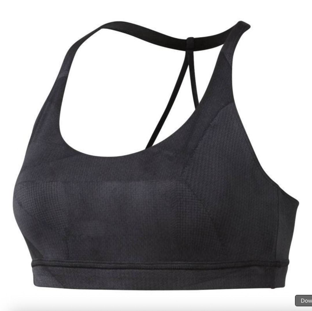 Reebok Grey Sports Bra (Category: Activewear) located in Mandaluyong City. Submitted by alyscloset_ (Listing ID 1428439163, Image 1). Description: Reebok sports bra features a racerback design and a supportive fit. It is a dark grey color. The bra has a textured pattern on the fabric. The bra has a comfortable underbust band..