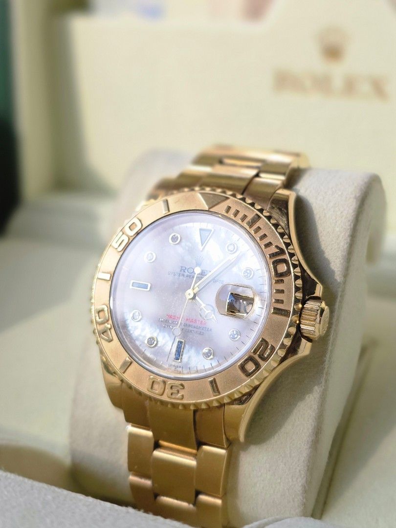 Rolex Yacht-Master Gold Watch (Category: Luxury Watches) located in Las Pinas. Submitted by arjayonly (Listing ID 1428496783, Image 3). Description: Ref. 16628 Yacht-Master in solid 18k Yellow Gold, Factory Mother of Pearl dial with Sapphire and Diamond "Serti" markers. ​This isn't standard configuration, the MOP dial has incredible natural iridescence that must be seen in person to be appreciated. ​CONDITION: Excellent. Sharp case lines, crisp b