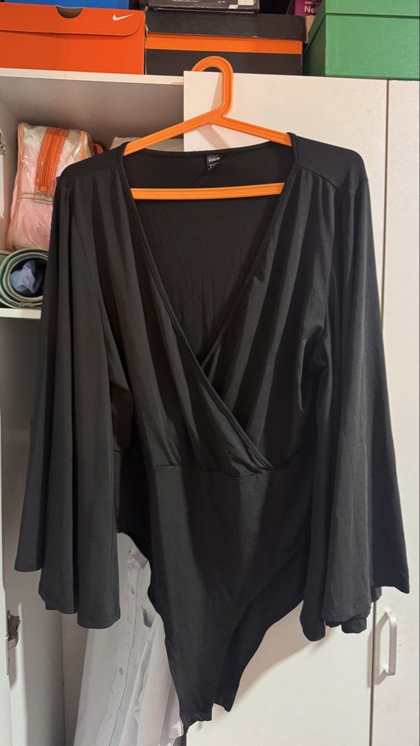 SHEIN Black Bodysuit with Bell Sleeves Plus Size (Category: Others Tops) located in Pasig City. Submitted by gbrllsph (Listing ID 1428595124, Image 1). Description: Medium seen on tag but can fit 3XL-5XL. Never used, fitted twice pero sobrang laki kasi talaga. Plus size talaga. Nice quality! Stretchy, comfortable fabric and snap closure at the bottom.
