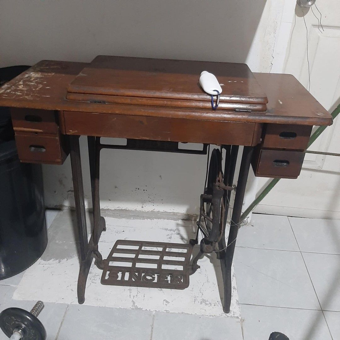 Singer Sewing Machine with Wooden Table (Category: Tables & Sets) located in Quezon City. Submitted by winssian (Listing ID 1428519839, Image 1). Description: Singer Table Sewing Machine pickup only Meycauyan Bulacan hi speed machine needs fixing other than that complete and no damage on table .
