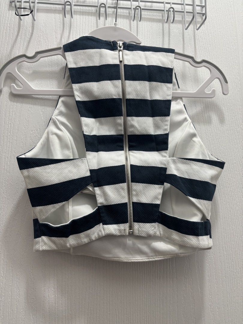 Stradivarius Nautical Stripe Crop Top (Category: Others Tops) located in Makati City. Submitted by declutterwithmeeeee (Listing ID 1428596514, Image 3). Description: Stradivarius top with classic navy and white horizontal stripes. Features a back zipper for easy wear. Worn only once, in excellent condition..