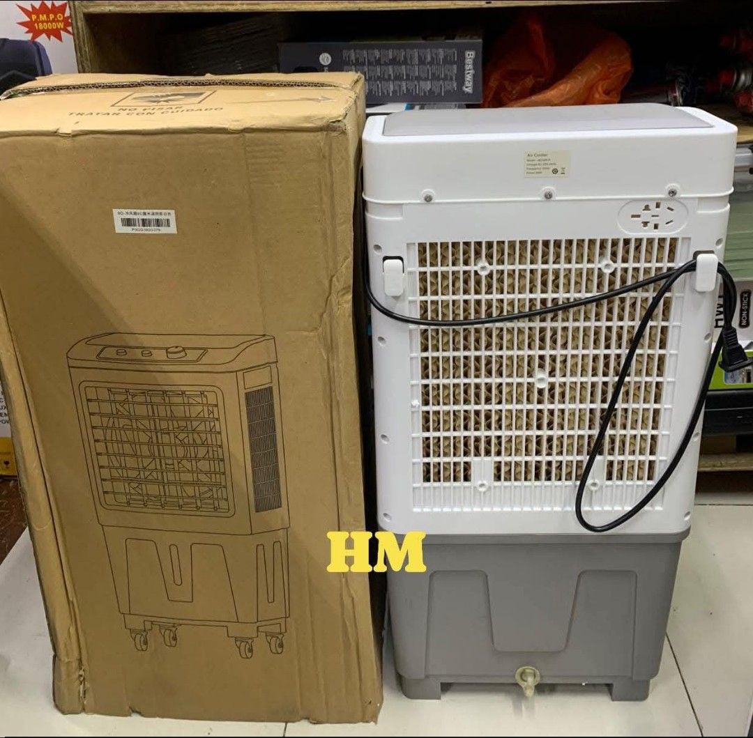 Tixx Air Cooler JB2626-R (Category: Air Conditioning and Heating) located in Manila. Submitted by jelai.cybyb (Listing ID 1428558938, Image 3). Description: Tixx Air Cooler with remote control and user manual. Features include speed, swing, timer, and cool settings. Includes ice packs for enhanced cooling. Model JB2626-R. Voltage AC 220-240V, Frequency 50Hz, Power 60W. Dimensions are 410x315x760mm. Net weight is 4.7 kg, gross weight is 6.0 kg. Co