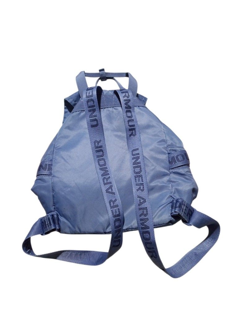 Under Armour Drawstring Backpack (Category: Backpacks) located in Tigaon. Submitted by tigaonthrifters (Listing ID 1428562928, Image 3). Description: Under Armour drawstring backpack is made of nylon. It features a drawstring closure, adjustable straps, and the Under Armour logo. The backpack has a blue exterior with the Under Armour logo on the front. The interior has a patterned design. The style number is 1369211. Product Details Capacity: Typ