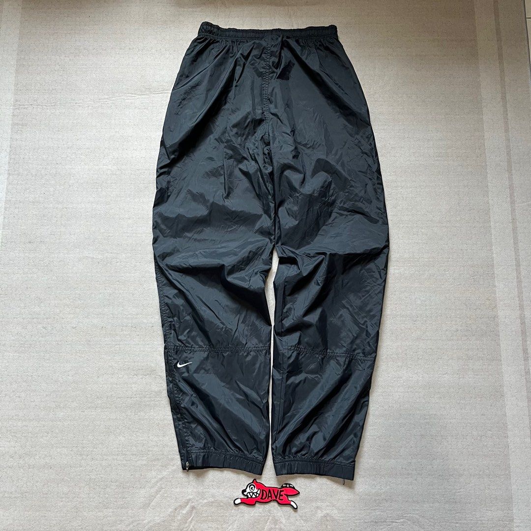 Vintage 1999 Black Nike Track Pants (Category: Joggers) located in Quezon City. Submitted by _daviddpintoo (Listing ID 1428450802, Image 2). Description: Vintage 1999 Black Ni/ke Track Pants (White Back Embroidered Swoosh) Excellent Condition -minor unnoticeable stains Waist: 28 to 36 inches adjustable with drawstring Length: 42 inches Thigh: 12 inches Leg Opening: 7 inches adjustable with ankle zip ₱750 +shipping fee NOTE: Color may vary due to 