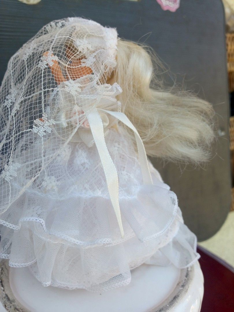 Vintage Bride Barbie Doll cake display (Category: Figurines & Statues) located in Marikina City. Submitted by norman213 (Listing ID 1428438406, Image 2). Description: Vintage Barbie doll is dressed as a bride. She is wearing a white wedding dress with a veil. The doll is standing on a white base. The doll has blonde hair and blue eyes..