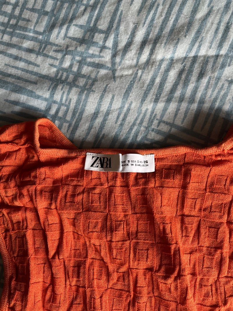 Zara Orange Textured Tank Top (Category: Sleeveless) located in Makati City. Submitted by megsellsstuff (Listing ID 1428432519, Image 3). Description: nice for morena skin tone.