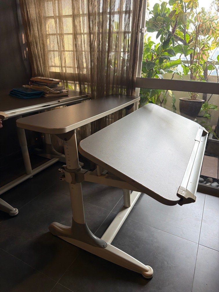 Adjustable study table (Category: Tables & Sets) located in Kuala Lumpur. Submitted by secondnest (Listing ID 1428704350, Image 2). Description: • Adjustable kids study table (90–170 cm) • Preloved | Good condition | Height adjustable • Great value 👍.
