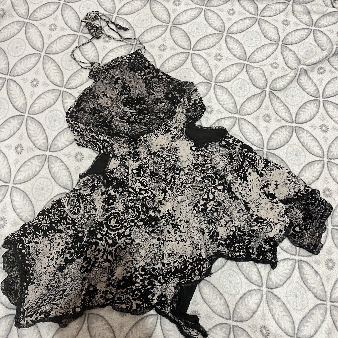 ANGL Black and White Dress (Category: Dresses) located in Rodriguez. Submitted by decluttrey (Listing ID 1428725452, Image 3). Description: Features a unique black and white paisley pattern. It has a halter neck design and a flowing, asymmetrical hemline, as well as a black lining. The inner short is torn but can be sewn or repaired (Still usable even as is). Size S on tag Still nego.