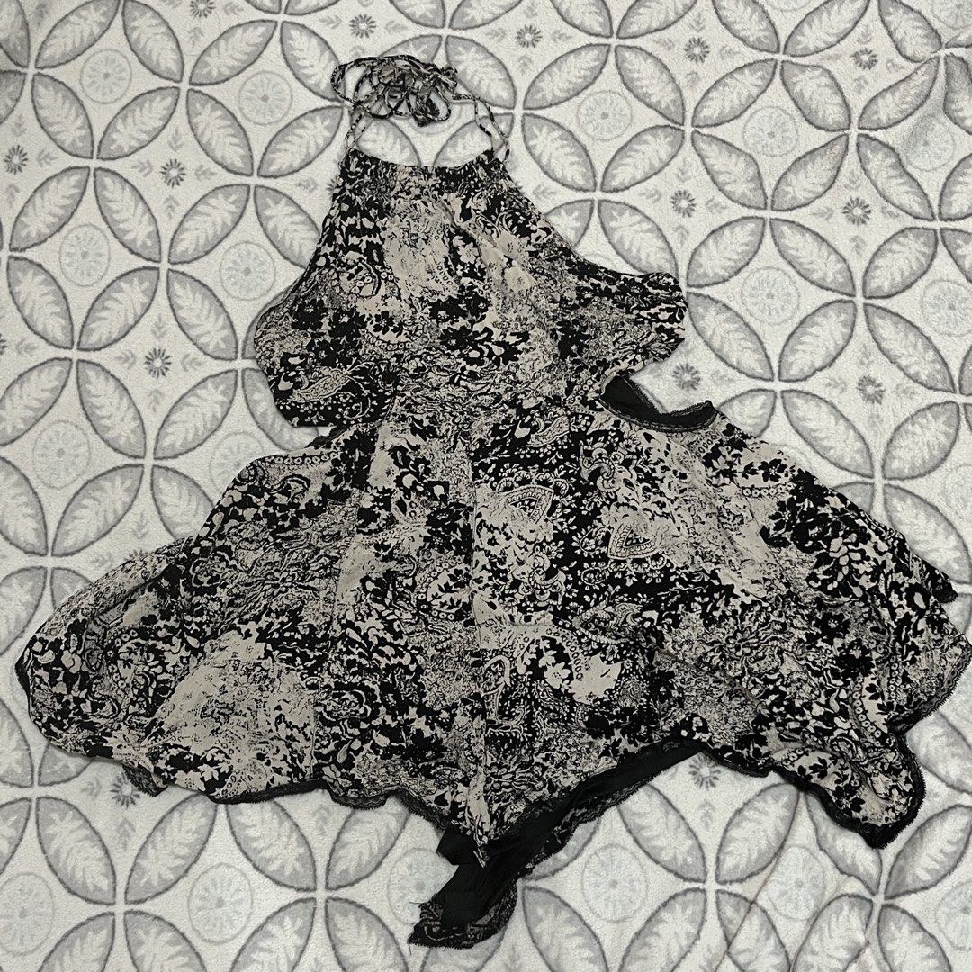ANGL Black and White Dress (Category: Dresses) located in Rodriguez. Submitted by decluttrey (Listing ID 1428725452, Image 1). Description: Features a unique black and white paisley pattern. It has a halter neck design and a flowing, asymmetrical hemline, as well as a black lining. The inner short is torn but can be sewn or repaired (Still usable even as is). Size S on tag Still nego.