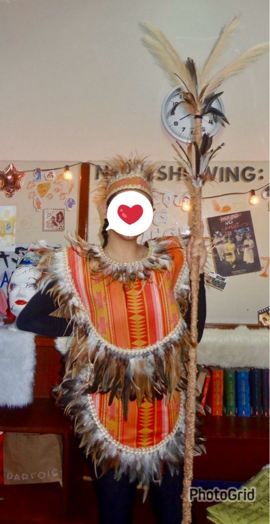 Ati-atihan Costume Set with Feathers (Category: Sets or Coordinates) located in Quezon City. Submitted by clicked.picks (Listing ID 1428733895, Image 2). Description: Ati-atihan costume set includes a headpiece, a top, and a bottom piece, all adorned with feathers. The pieces feature a vibrant red and gold patterned fabric. The edges are trimmed with a cream-colored border..