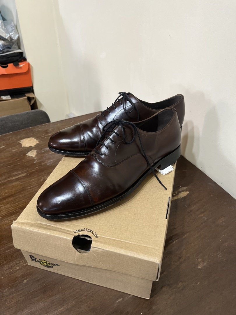 Authentic Prada Captoe Oxford Brown Leather shoes (Category: Dress Shoes) located in Muntinlupa City. Submitted by samurai_shine_allen (Listing ID 1428670156, Image 3). Description: Prada Captoe Oxford Dark Brown “9US” In Very Good Condition P5.2k only Details: - No issues regarding upper or sole - Original Leather Shoe - Hidden Stitched Outsole - Rich Dark Brown Shade.