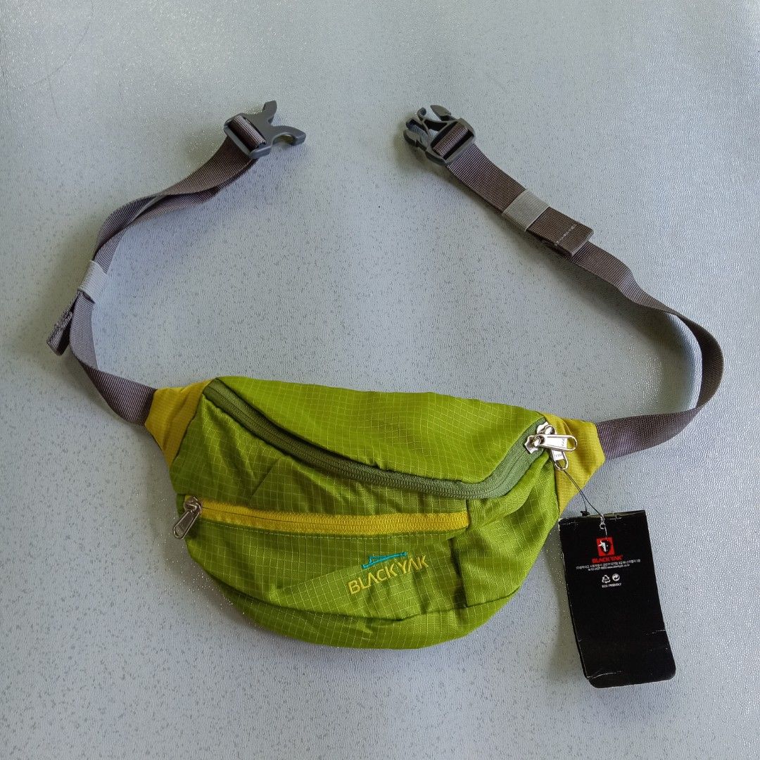 Black Yak Waist Bag (Category: Belt bags, Clutches and Pouches) located in Polomolok. Submitted by instajunk.phv2 (Listing ID 1428739047, Image 3). Description: Black Yak waist bag features a vibrant green color with yellow accents. It has multiple zippered compartments for secure storage. The bag includes an adjustable strap and a mesh back panel for comfort. The Black Yak logo is visible on the front..
