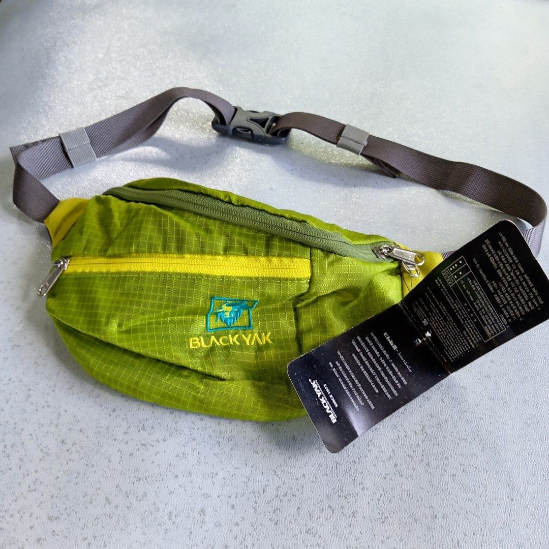 Black Yak Waist Bag (Category: Belt bags, Clutches and Pouches) located in Polomolok. Submitted by instajunk.phv2 (Listing ID 1428739047, Image 2). Description: Black Yak waist bag features a vibrant green color with yellow accents. It has multiple zippered compartments for secure storage. The bag includes an adjustable strap and a mesh back panel for comfort. The Black Yak logo is visible on the front..