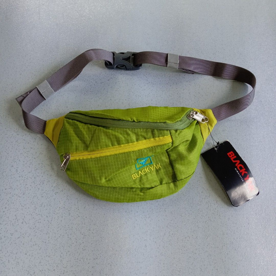 Black Yak Waist Bag (Category: Belt bags, Clutches and Pouches) located in Polomolok. Submitted by instajunk.phv2 (Listing ID 1428739047, Image 1). Description: Black Yak waist bag features a vibrant green color with yellow accents. It has multiple zippered compartments for secure storage. The bag includes an adjustable strap and a mesh back panel for comfort. The Black Yak logo is visible on the front..