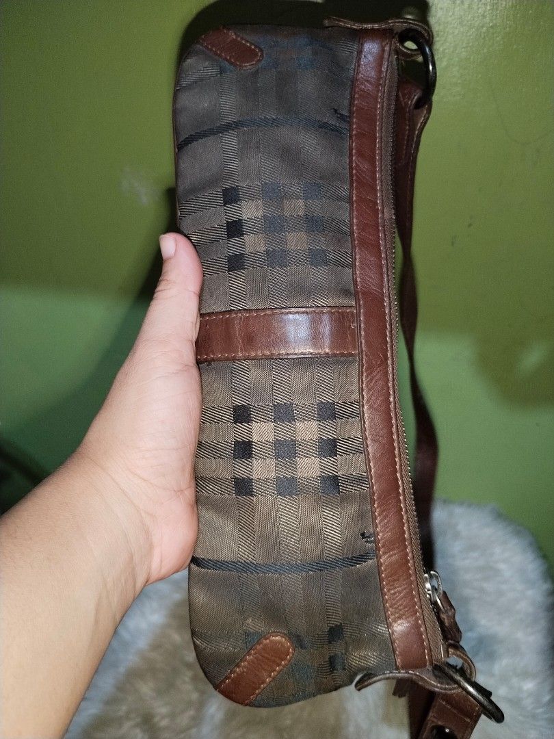 Burberry Shoulder Bag (Category: Luxury Bags & Wallets) located in Bacolod City. Submitted by maejuntado33 (Listing ID 1428712911, Image 2). Description: Authentic Burberry shoulder bag. Features a classic check pattern with brown leather trim and strap. The bag has a zipper closure and a small interior pocket. Made in Italy..
