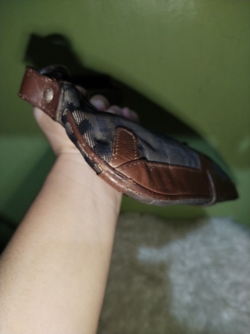 Burberry Shoulder Bag (Category: Luxury Bags & Wallets) located in Bacolod City. Submitted by maejuntado33 (Listing ID 1428712911, Image 3). Description: Authentic Burberry shoulder bag. Features a classic check pattern with brown leather trim and strap. The bag has a zipper closure and a small interior pocket. Made in Italy..
