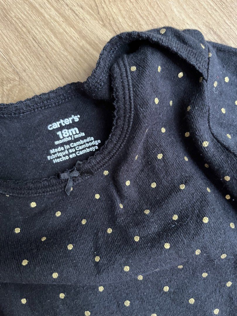 Carter's 18M Black Polka Dot Onesie (Category: Babies & Kids Fashion) located in Manila. Submitted by gtwins (Listing ID 1428670128, Image 3). Description: Carter's onesie is designed for babies aged 18 months. It features a black base with gold polka dots and long sleeves. The onesie has snap closures at the bottom for easy diaper changes. Made in Cambodia..