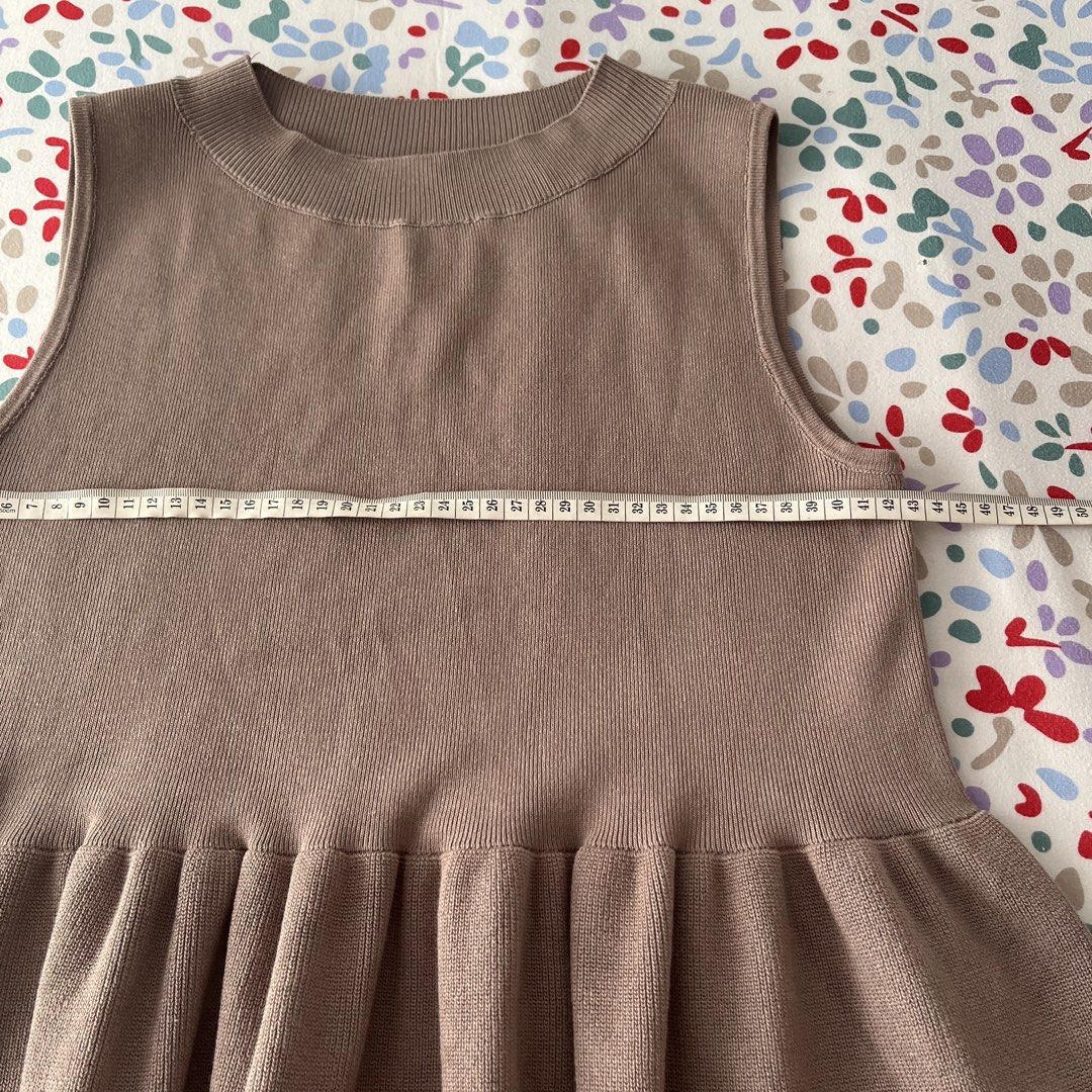 Coca Sleeveless Top peplum top (Category: Sleeveless) located in San Juan City. Submitted by 1104basics (Listing ID 1428644728, Image 3). Description: Sleeveless top is in a brown color. It has a round neckline and a flared hem. The top is size M. See photos for measurements..