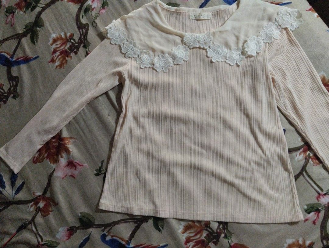 Cream Ribbed Blouse with Lace Collar (Category: Blouses) located in Taytay. Submitted by calige4n (Listing ID 1428772681, Image 1). Description: Cream-colored ribbed blouse with a delicate lace collar. Features long sleeves. A simple and elegant top suitable for various occasions. The blouse has a round neckline..