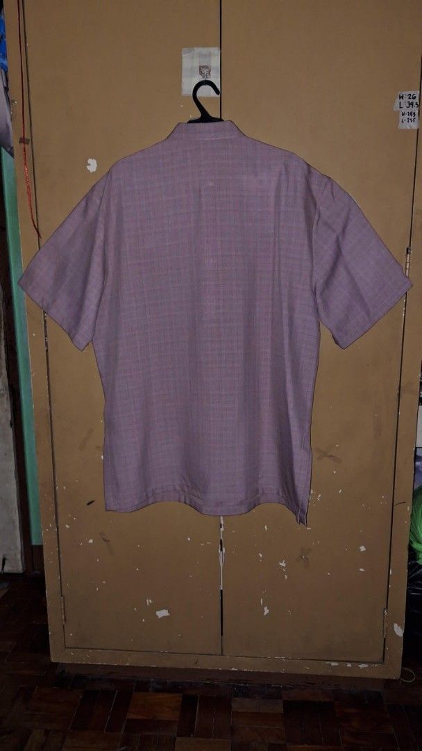 Embroidered Checkered Short Sleeve Shirt (Category: Formal Shirts) located in Quezon City. Submitted by dealmaker8 (Listing ID 1428635696, Image 2). Description: Short-sleeved shirt features a checkered pattern and embroidered details on the front. It has a button-down design and a classic collar. The color is a muted shade, possibly a dark color pink. It has a regular fit. Size width 24.5 length 31 pick up location QC near ateneo.