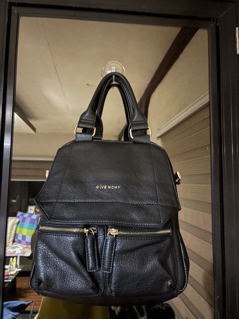 Givenchy Antigona Backpack (Category: Luxury Bags & Wallets) located in Bulacan. Submitted by love2loved (Listing ID 1428767810, Image 2). Description: Black Givenchy Antigona backpack. Features two front zip pockets, top handle, and adjustable shoulder straps. The interior has a Givenchy label. The bag has gold-tone hardware. The back of the bag has a zip pocket. The bag can be converted into a shoulder bag. Good condition Signs of wear Maganda 