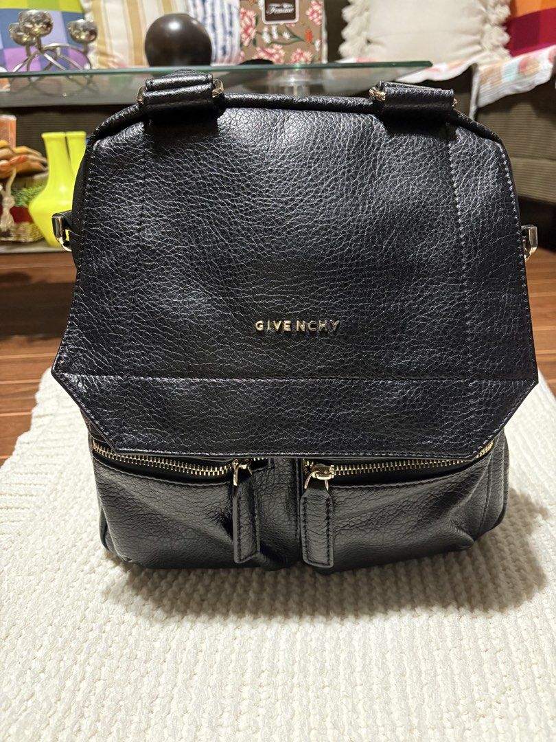 Givenchy Antigona Backpack (Category: Luxury Bags & Wallets) located in Bulacan. Submitted by love2loved (Listing ID 1428767810, Image 1). Description: Black Givenchy Antigona backpack. Features two front zip pockets, top handle, and adjustable shoulder straps. The interior has a Givenchy label. The bag has gold-tone hardware. The back of the bag has a zip pocket. The bag can be converted into a shoulder bag. Good condition Signs of wear Maganda 