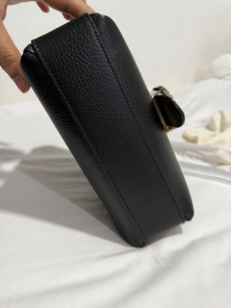 Gucci Soho Disco Shoulder Bag Black (Category: Luxury Bags & Wallets) located in Pasay City. Submitted by timeforathrift (Listing ID 1428682644, Image 3). Description: Black Gucci Soho Disco shoulder bag. Features a flap closure with a gold-tone interlocking GG logo. Includes a detachable shoulder strap and a dust bag. The interior has multiple compartments. Comes with authenticity cards. NO TO LOWBALLERS. Message for inquiries..