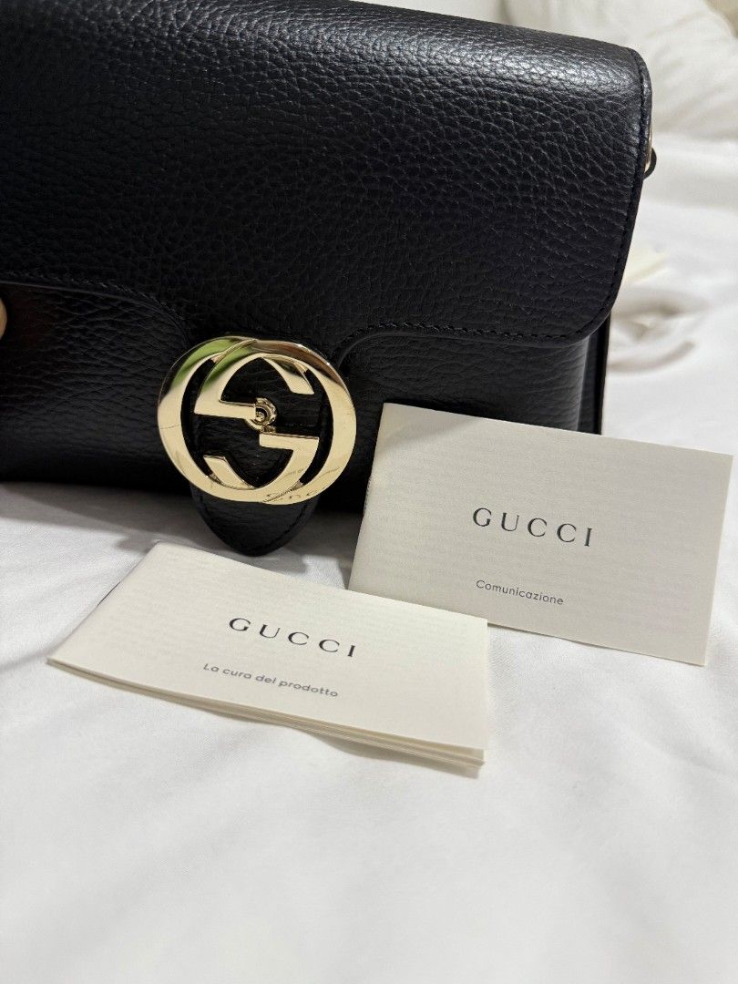 Gucci Soho Disco Shoulder Bag Black (Category: Luxury Bags & Wallets) located in Pasay City. Submitted by timeforathrift (Listing ID 1428682644, Image 2). Description: Black Gucci Soho Disco shoulder bag. Features a flap closure with a gold-tone interlocking GG logo. Includes a detachable shoulder strap and a dust bag. The interior has multiple compartments. Comes with authenticity cards. NO TO LOWBALLERS. Message for inquiries..