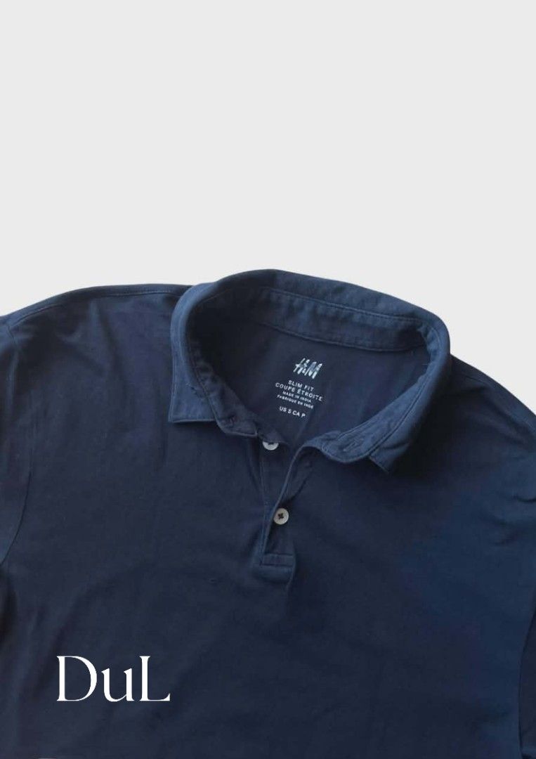 H&M Black Polo Shirt (Category: Tshirts & Polo Shirts ) located in Manila. Submitted by dulthriftcollection3 (Listing ID 1428753711, Image 1). Description: H&M polo shirt is black. It has a classic collar and a three-button placket. The H&M logo is visible on the inside collar. It's a versatile piece suitable for casual wear..