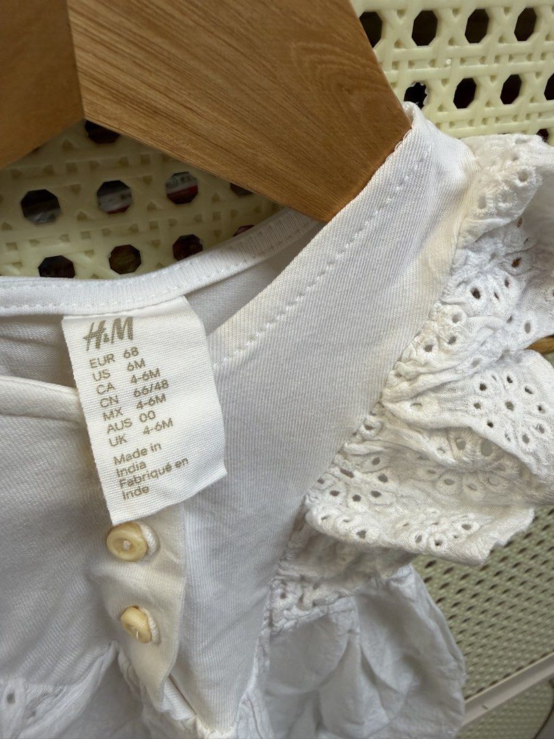 H&M White Eyelet Dress 6M (Category: Babies & Kids Fashion) located in Cavite. Submitted by luxebagsco_ (Listing ID 1428637280, Image 3). Description: Can fit 6-9mos Cotton with eyelet design.
