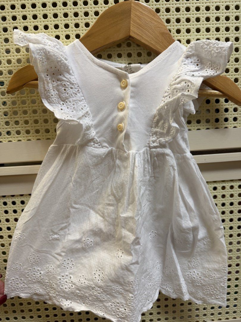 H&M White Eyelet Dress 6M (Category: Babies & Kids Fashion) located in Cavite. Submitted by luxebagsco_ (Listing ID 1428637280, Image 1). Description: Can fit 6-9mos Cotton with eyelet design.