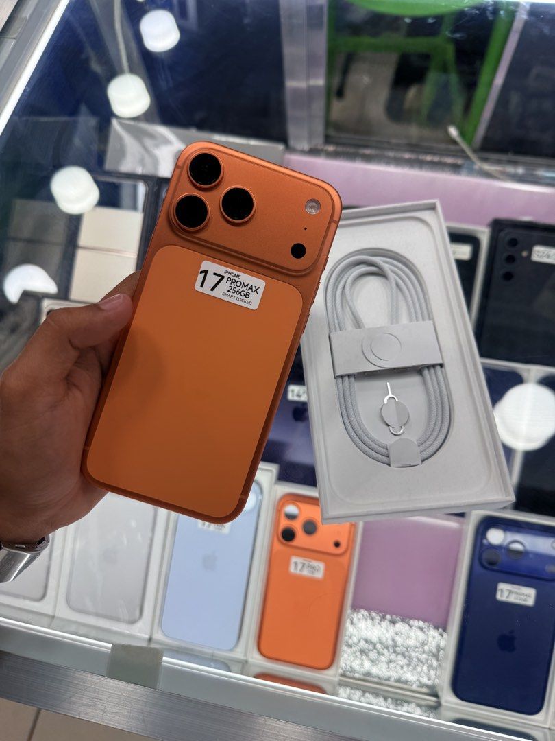 iPhone 17 Pro Max Smart Lock Complete 19 cycle count (Category: iPhone 17 Series) located in Manila. Submitted by carimgadgets (Listing ID 1428676519, Image 1). Description: - iPhone 17 Pro Max - Cosmic Orange color - Smart Lock unit - Complete with box and accessories - Only 19 cycle count.