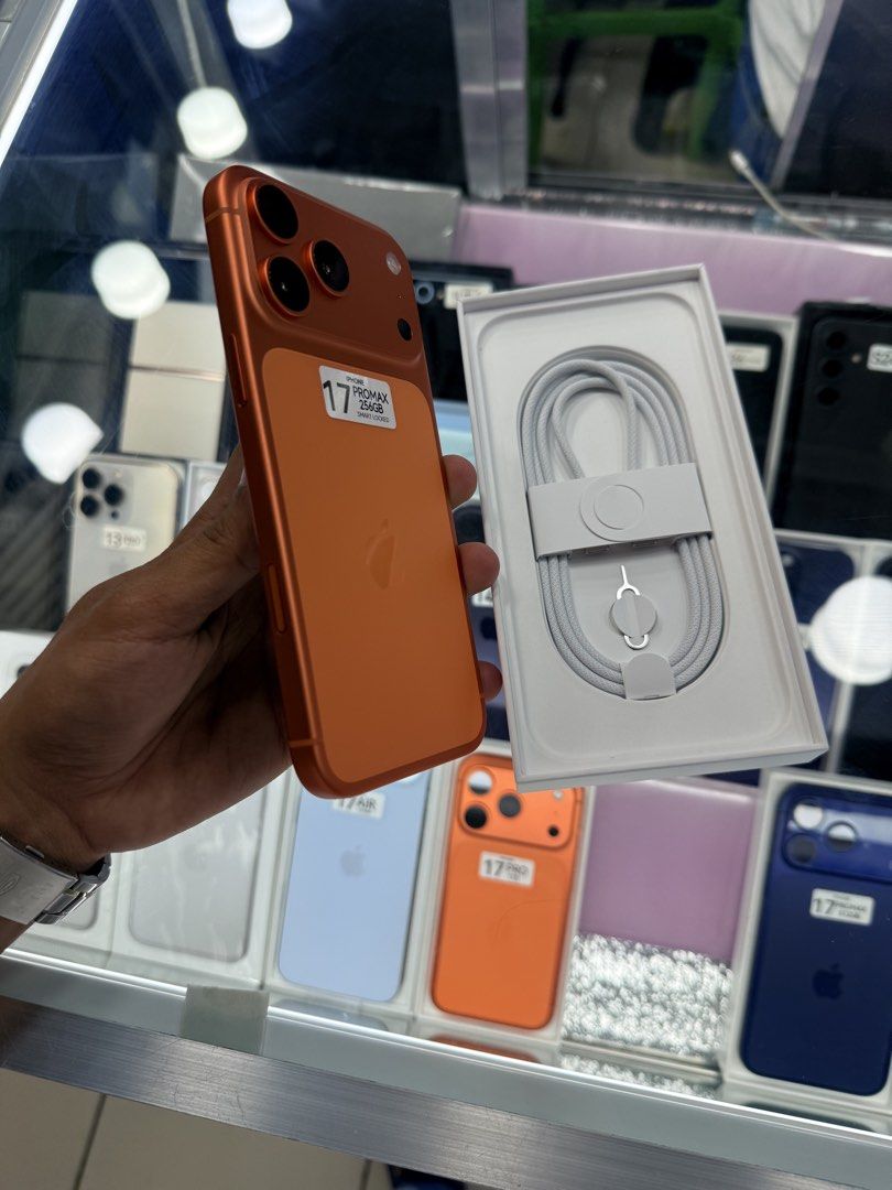 iPhone 17 Pro Max Smart Lock Complete 19 cycle count (Category: iPhone 17 Series) located in Manila. Submitted by carimgadgets (Listing ID 1428676519, Image 2). Description: - iPhone 17 Pro Max - Cosmic Orange color - Smart Lock unit - Complete with box and accessories - Only 19 cycle count.