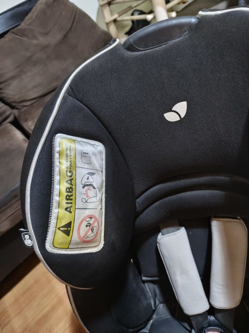 Joie Car Seat (Category: Car Seats) located in Paranaque City. Submitted by judy.arquillos (Listing ID 1428651509, Image 3). Description: Black Joie car seat. Features include a headrest, shoulder pads, and a five-point harness. The seat has side impact protection and is suitable for children from 0-18kg. The seat has a red adjustment lever and a label indicating the correct installation. The seat has a Joie logo. 2000+SHIP J&T LALAMOVE PICK-UP.