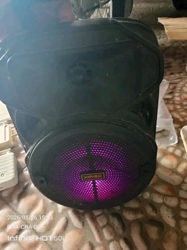 Kuku K-1090 Wireless Speaker with Microphone (Category: Soundbars, Speakers & Amplifiers) located in Lipa City. Submitted by newriver_a7c3ea (Listing ID 1428686615, Image 3). Description: Listing includes a Kuku K-1090 wireless speaker with a microphone. The speaker has multiple input options and a digital display. It also features LED lights. The speaker is black and has a built-in handle for easy carrying. The images also show other speakers, i