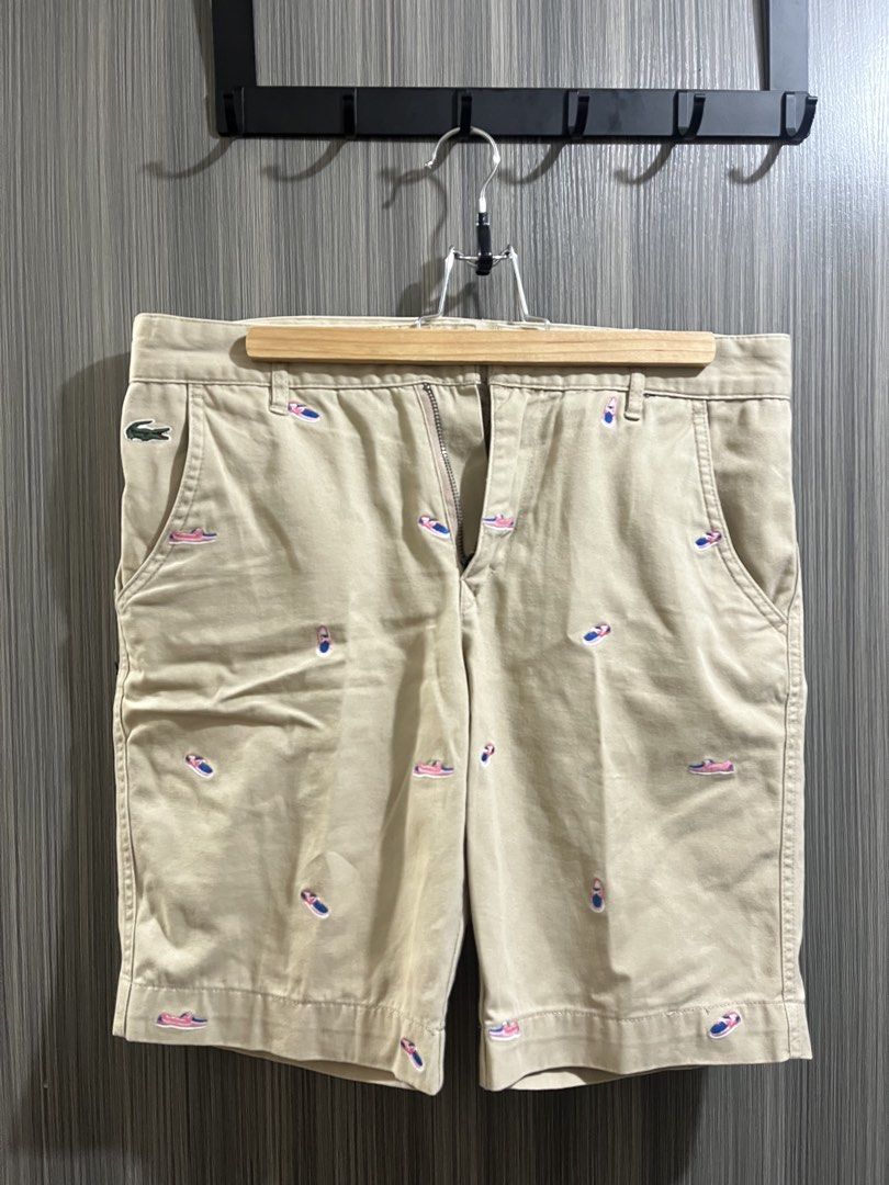 LACOSTE LIVE EMBROIDERED CHINO SHORTS (Category: Shorts) located in Manila. Submitted by cusmar_ (Listing ID 1428766264, Image 1). Description: LACOSTE CHINO SHORTS (FRENCH BRAND) - SIZE US 30 - KHAKI W/ PINK SPERRY SHOE EMBROIDERY - GOOD CONDITION, NO DEFECTS - WAIST: 16 inches| FRONT RISE: 11 inches| INSEAM: 9 inches| THIGH: 11 inches - NEGOTIABLE.