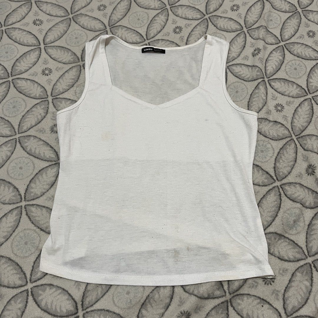 Lovito White Tank Top (Category: Sleeveless) located in Rodriguez. Submitted by decluttrey (Listing ID 1428758589, Image 1). Description: Size Large (L). Can fit Medium (M) Still nego.