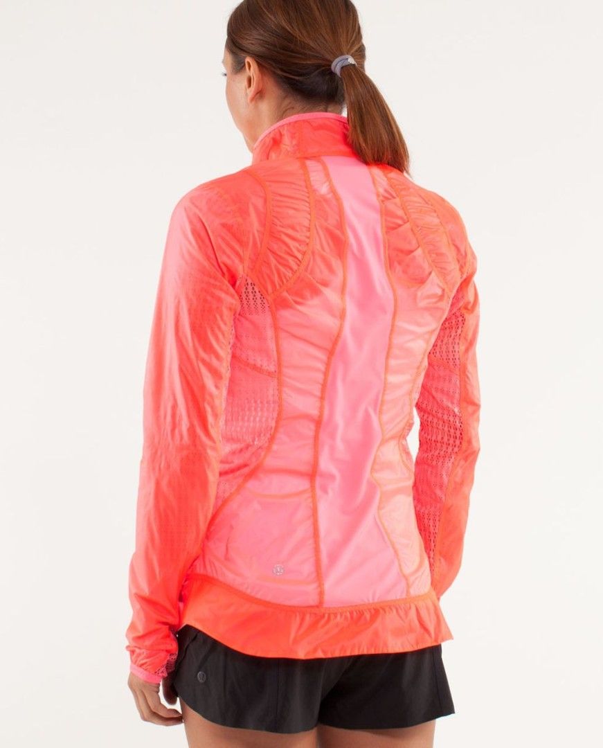 Lululemon Run : Nothin to Hide Jacket (Category: Activewear) located in Manila. Submitted by thriftspotting (Listing ID 1428655680, Image 3). Description: Bright pink Lululemon Run Swiftly jacket. Features a full zip closure, a high collar, and a fitted design. The jacket has a mesh panel on the back and under the arms for breathability. The size tag shows size 10. Includes a small zipper pocket with a Lululemon logo zipper pull..