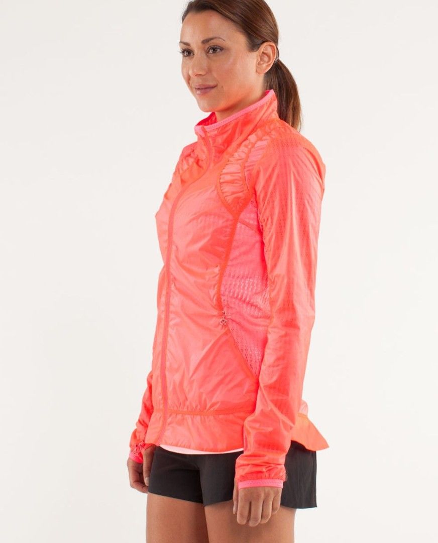 Lululemon Run : Nothin to Hide Jacket (Category: Activewear) located in Manila. Submitted by thriftspotting (Listing ID 1428655680, Image 2). Description: Bright pink Lululemon Run Swiftly jacket. Features a full zip closure, a high collar, and a fitted design. The jacket has a mesh panel on the back and under the arms for breathability. The size tag shows size 10. Includes a small zipper pocket with a Lululemon logo zipper pull..
