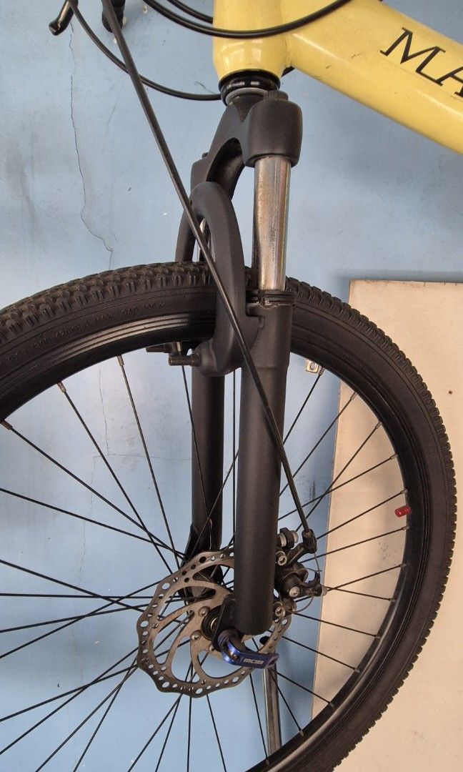MACCE bike (Category: Bicycles) located in Manila. Submitted by patrickoca46729 (Listing ID 1428724952, Image 3). Description: • Brand: MACCE • Bike Type: Hardtail Mountain Bike (MTB) • Frame: Painted yellow, likely high-carbon steel • Suspension: Front suspension fork (standard coil spring, great for light trails and bumpy roads). • Drivetrain/Gears: 21-Speed (3x7 setup). It has a 7-speed freewheel in the back and integrated trigger shifters on 