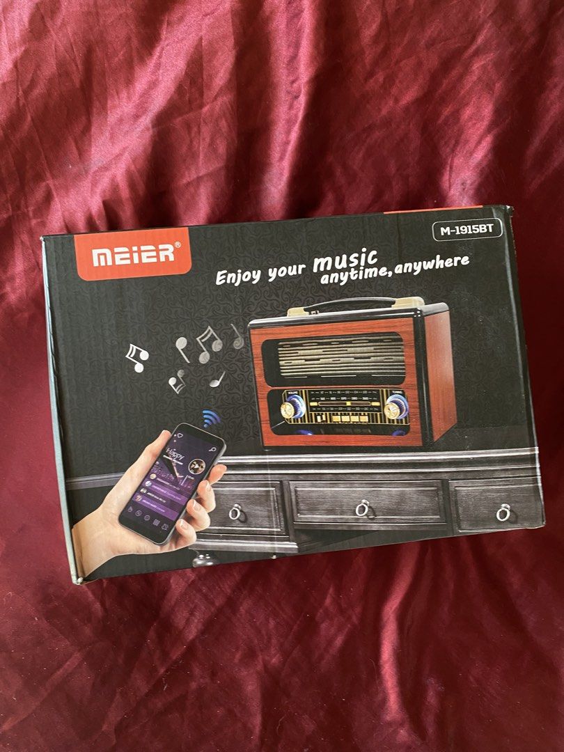 Meier M-1915BT Wireless Radio/Speaker Bluetooth (Category: Portable Music Players) located in Quezon City. Submitted by adadarna (Listing ID 1428615992, Image 3). Description: Enjoy your music anytime, anywhere with this Meier M-1915BT wireless radio. It features a wooden finish body frame and supports wireless music and data transfer. It has FM/AM/SW radio capabilities, a USB port, and an AUX input. The radio comes with a power cable. The box sh